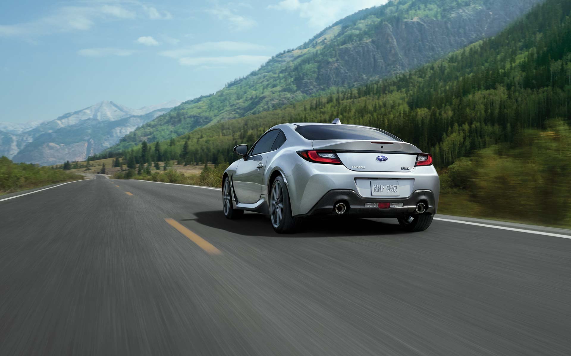 2022 Subaru BRZ Limited shown in Ice Silver Metallic driving down a highway.